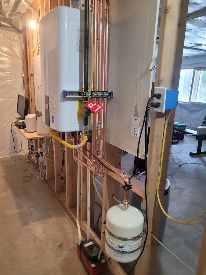 Licensed plumber repairing a kitchen sink in Trenton
